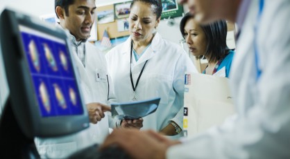 A group of doctors examining an MRI