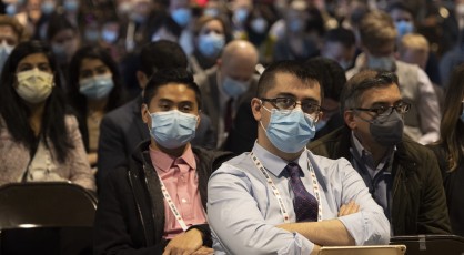 A group of attendees sitting in a theater.